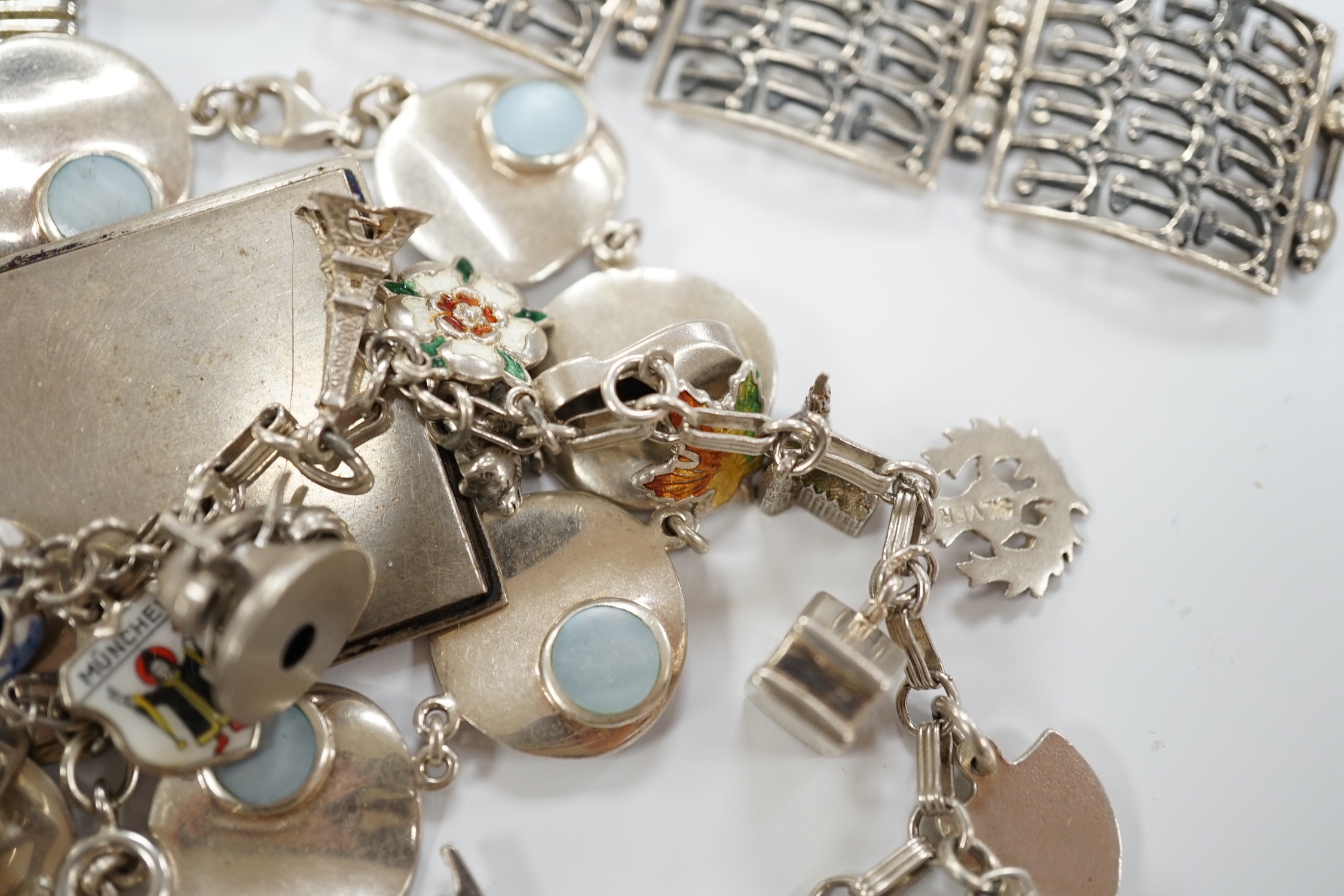 A quantity of assorted silver, white metal and sterling jewellery including brooches, cuff bracelets, charm bracelets, rings etc, gross weight 18.5oz.